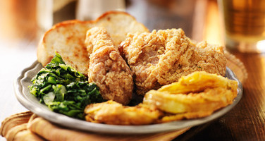 plate of fried chicken and collard greens