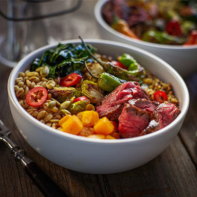 Colorful Nourish Bowl topped with Rare Steak