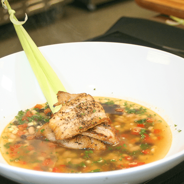 Grilled Pacific Rockfish in a Bean and Roasted Elote Tomato Broth