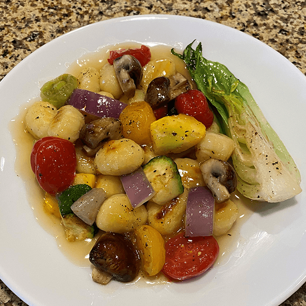 Pan Seared Farmers Market Vegetables and Gnocchi tossed in a Roasted Vegetable Jus